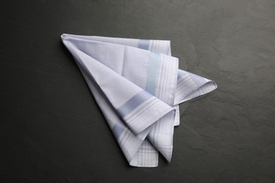 Photo of Handkerchief with pattern on black table, top view