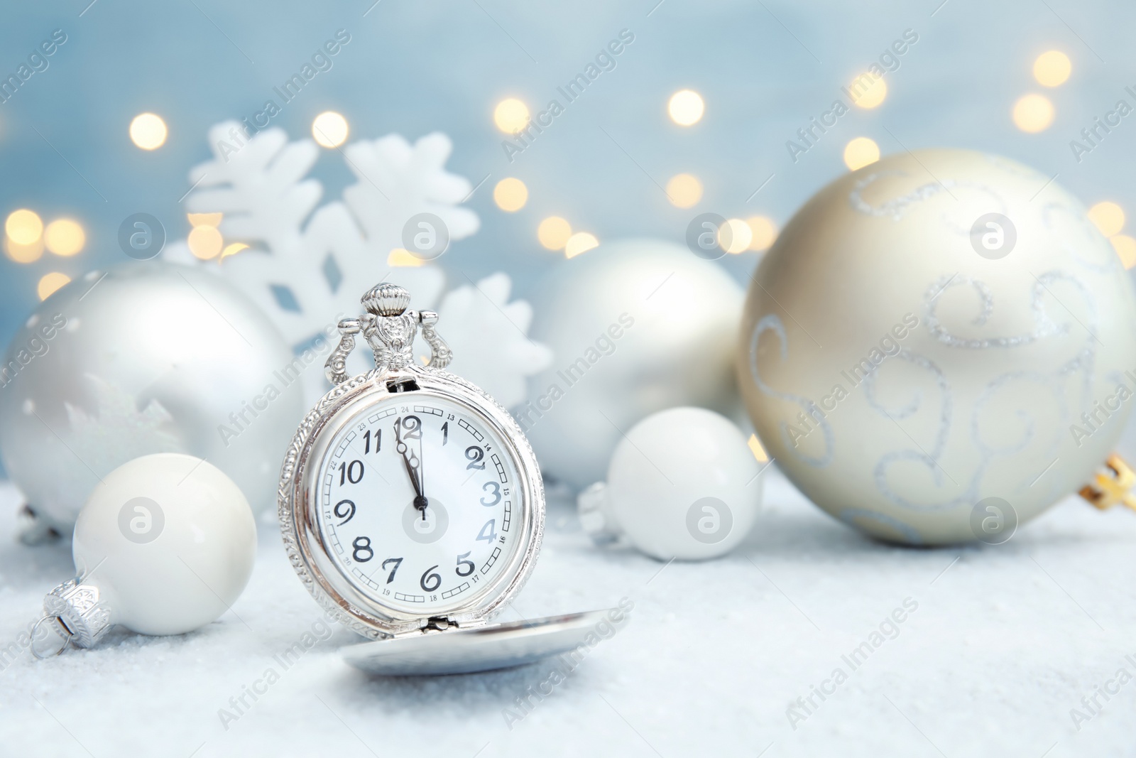 Photo of Pocket watch and festive decor on table. Christmas countdown