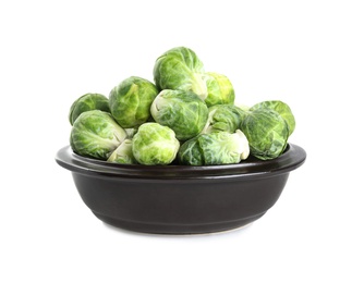 Photo of Fresh Brussels sprouts in bowl isolated on white