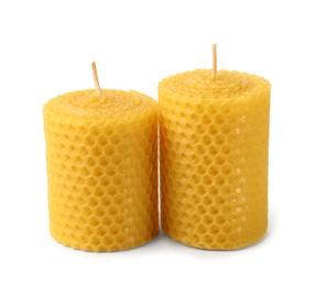 Photo of Stylish elegant beeswax candles isolated on white