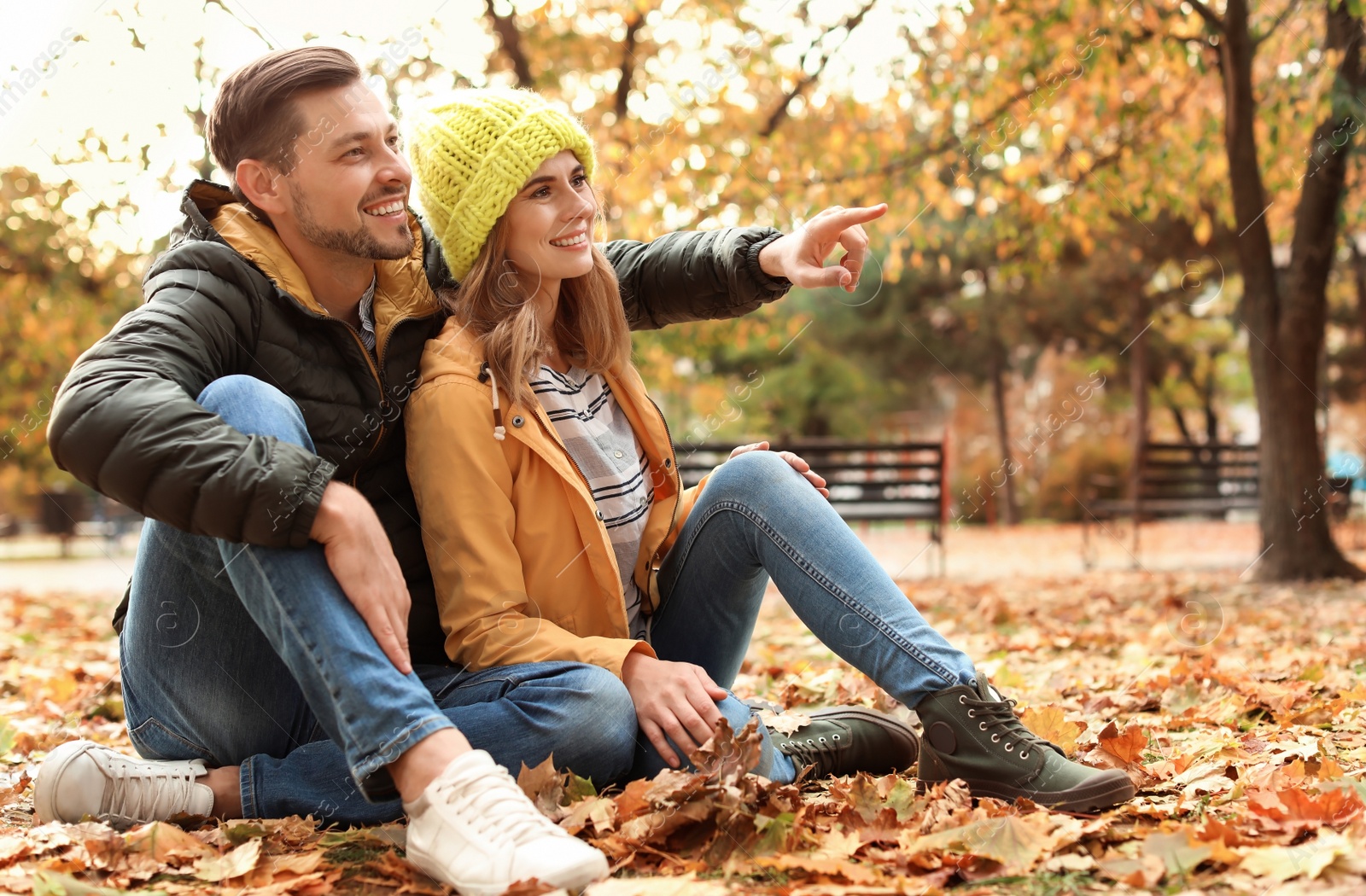 Photo of Lovely couple spending time together in park. Autumn walk