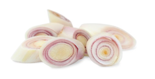 Photo of Slices of fresh lemongrass on white background