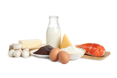 Fresh products rich in vitamin D on white background