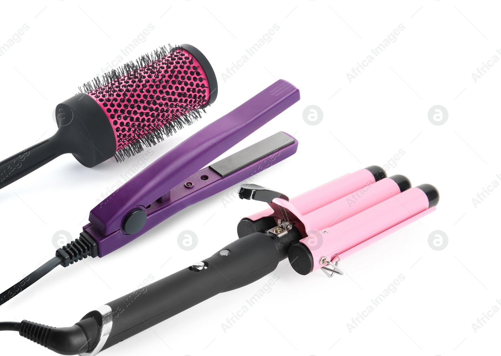 Image of Hair irons and round brush on white background