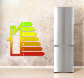 Image of Energy efficiency rating label and refrigerator indoors