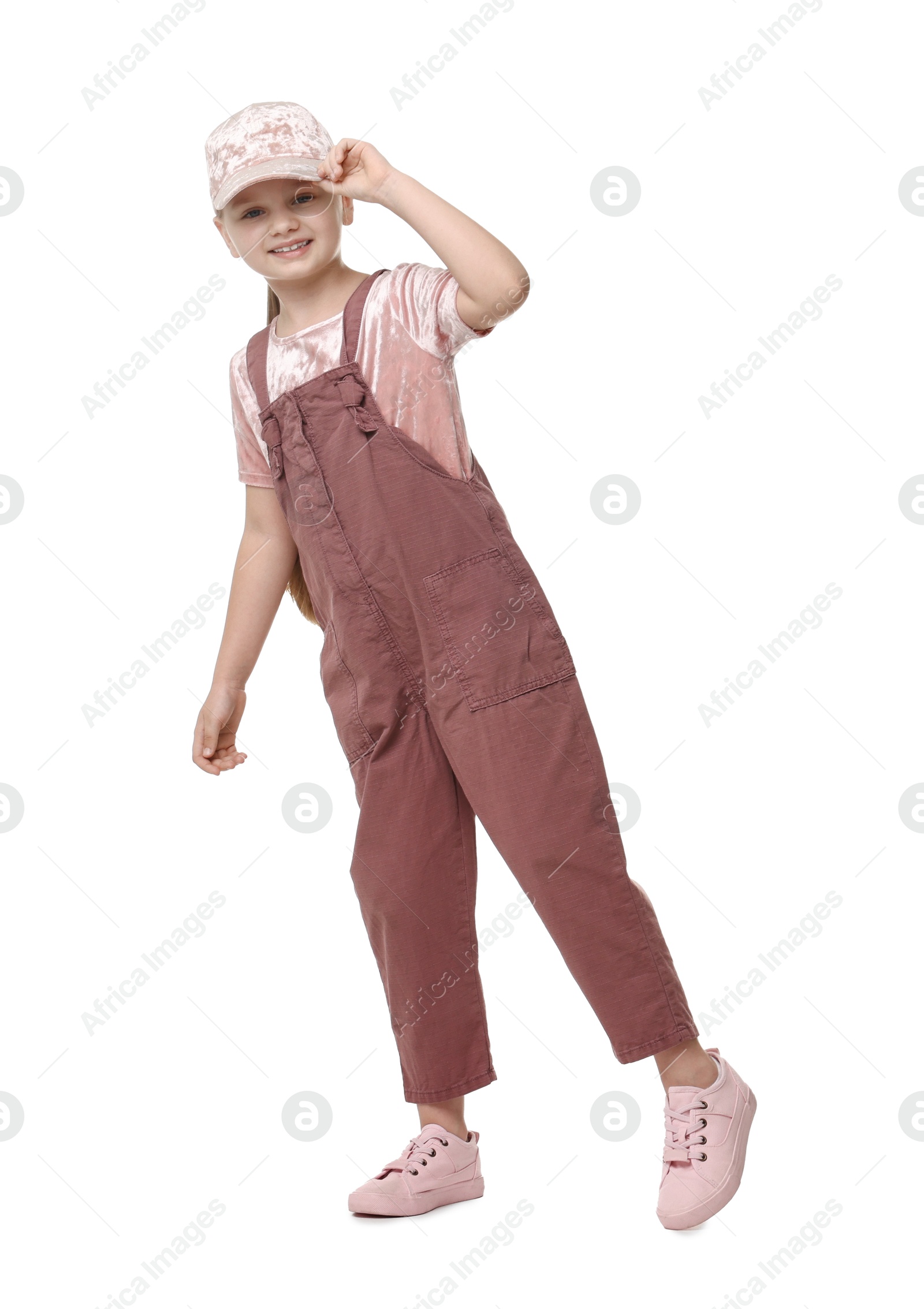 Photo of Cute little girl dancing on white background