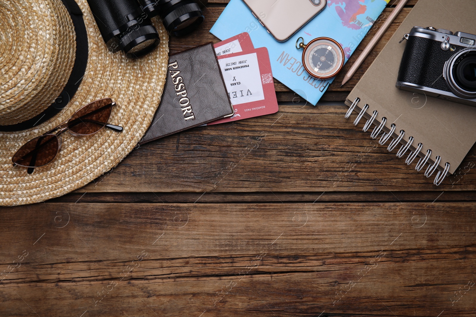 Photo of Flat lay composition with passport and tickets on wooden table. Space for text