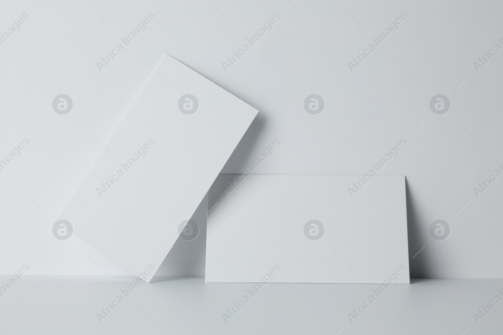 Photo of Blank business cards on white background. Mockup for design