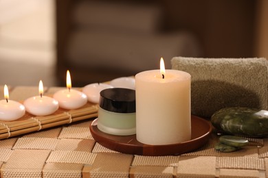 Beautiful composition with different spa products on wicker bench indoors