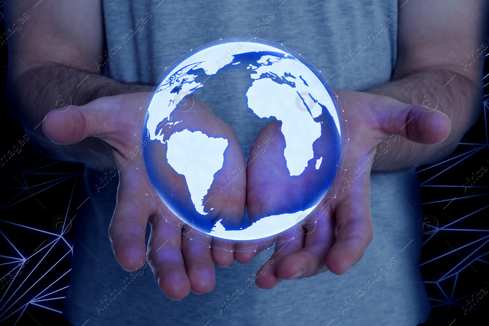 Image of Man demonstrating digital model of Earth on dark background, closeup