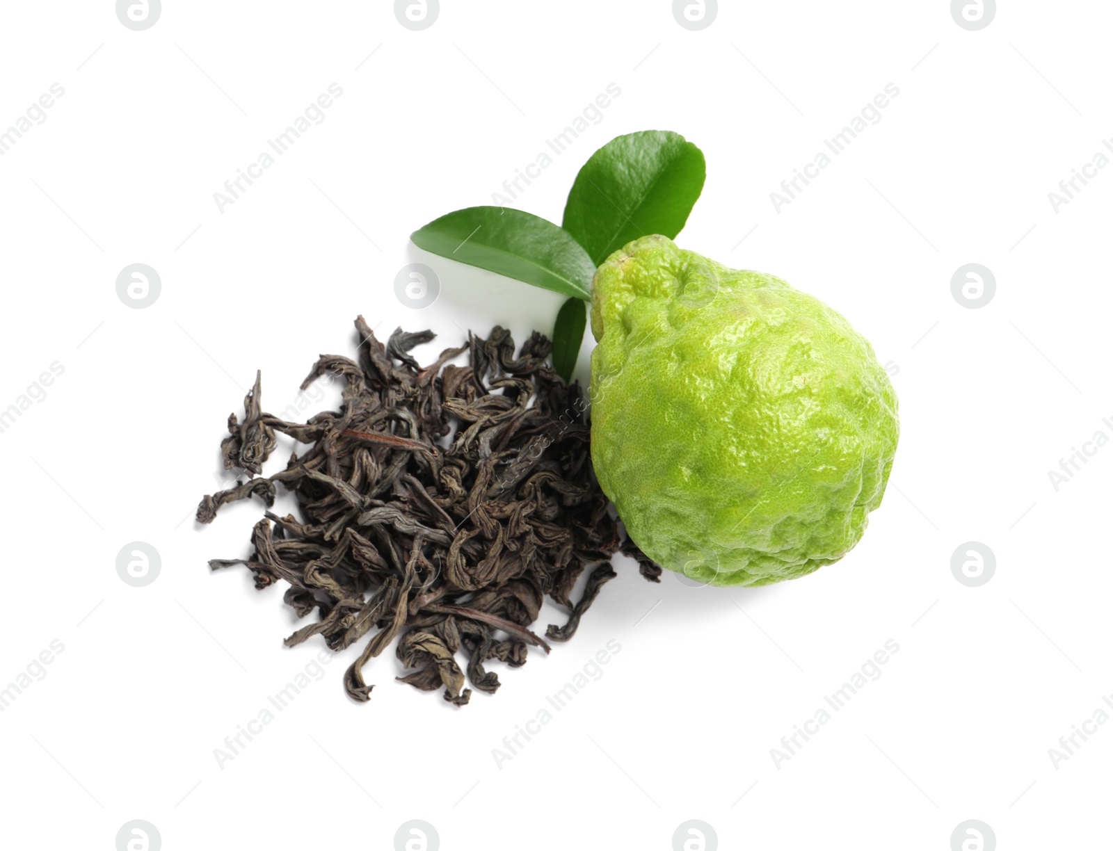 Photo of Pile of dry bergamot tea leaves and fresh fruit on white background, top view