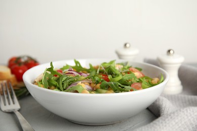 Photo of Delicious fresh chickpea salad on light grey table