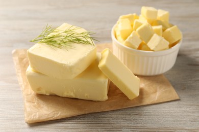 Photo of Tasty butter with dill on wooden table