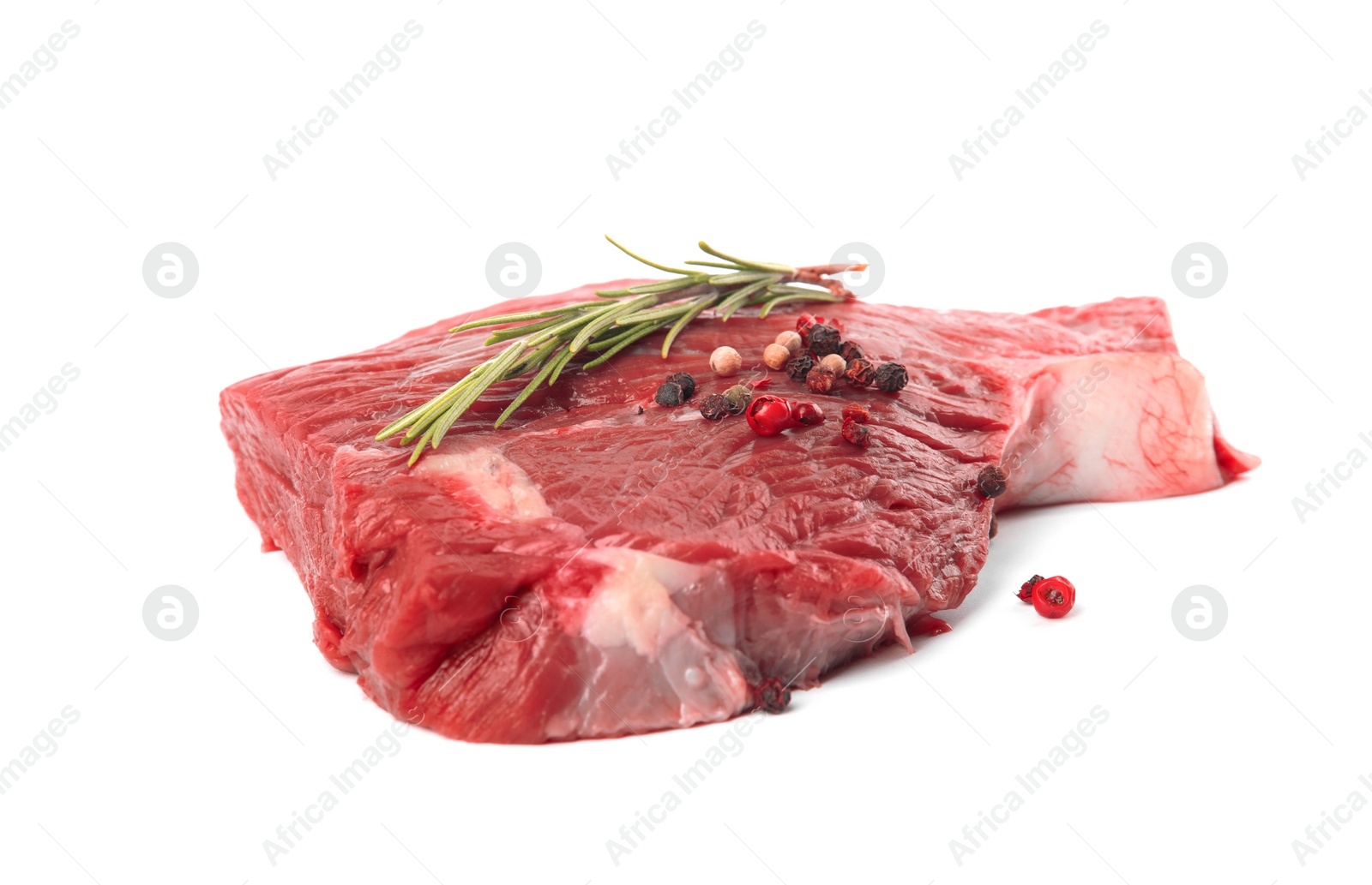 Photo of Fresh raw beef cut with rosemary and peppers mix isolated on white