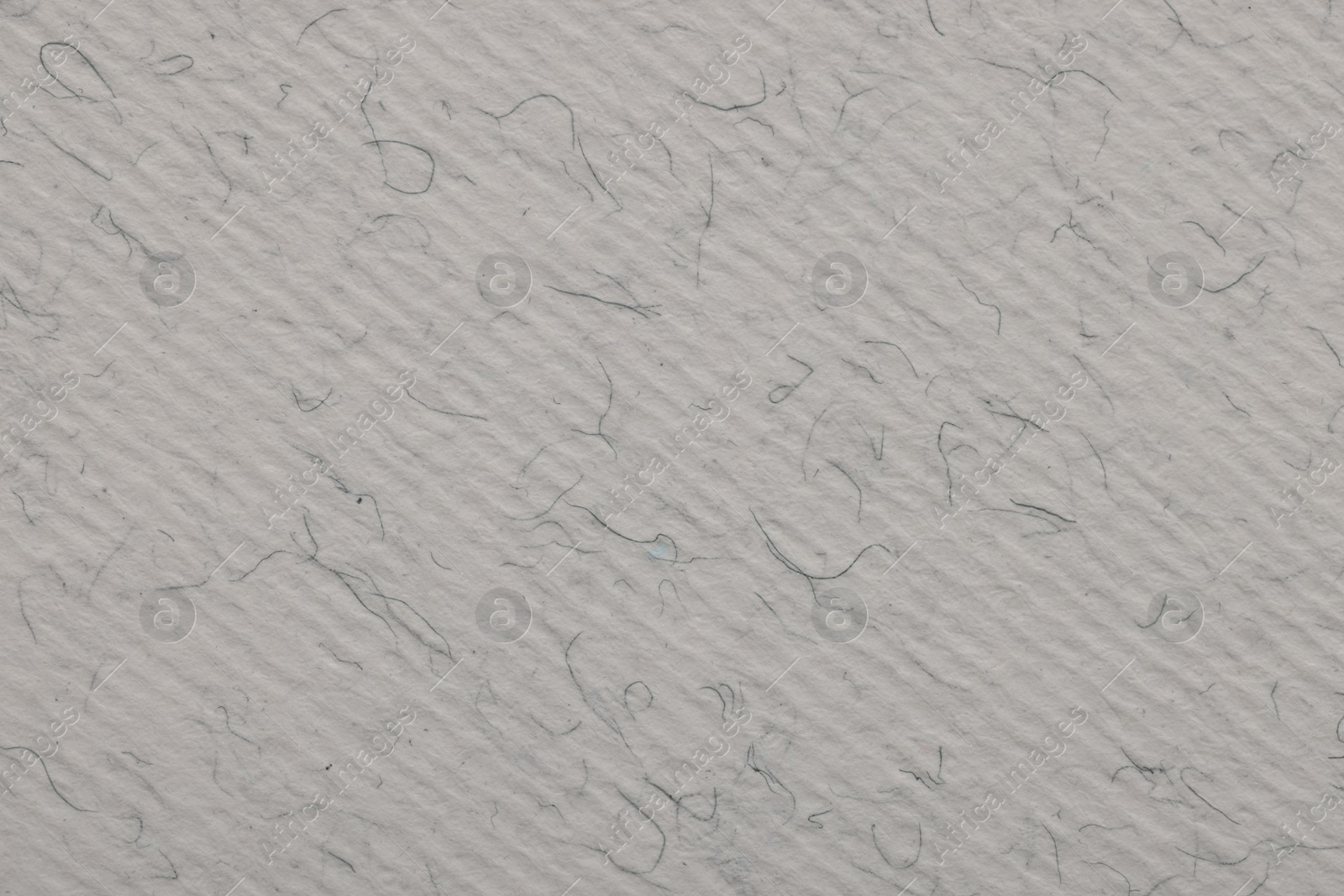 Photo of Texture of light grey paper sheet as background, top view