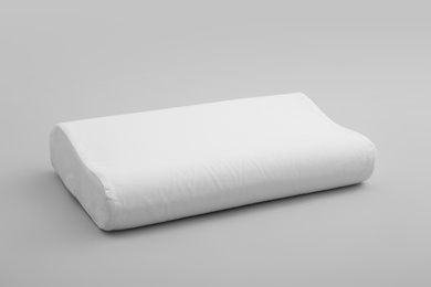 Photo of Clean soft orthopedic pillow on grey background