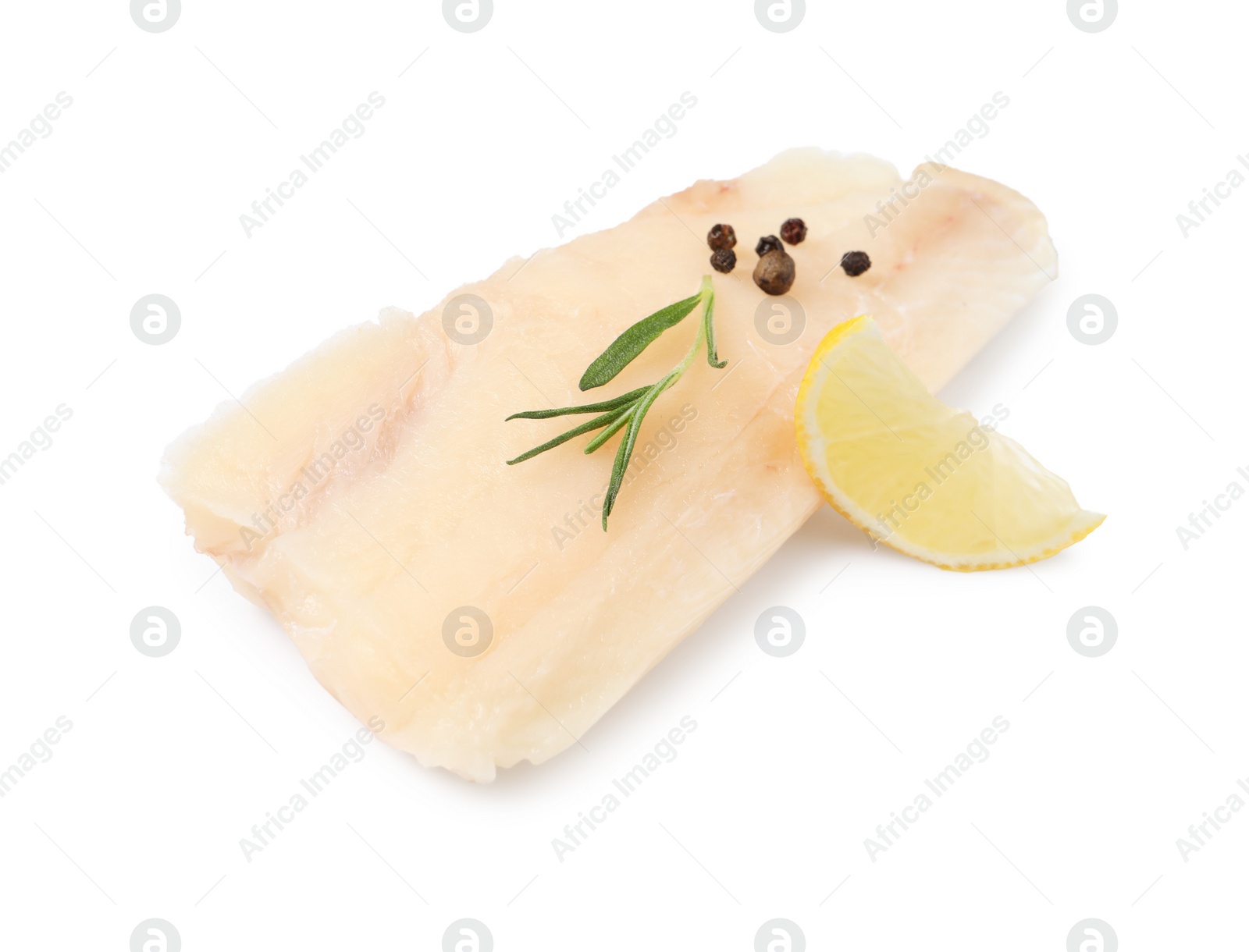 Photo of Pieces of raw cod fish, rosemary, peppercorns and lemon isolated on white