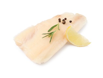Pieces of raw cod fish, rosemary, peppercorns and lemon isolated on white