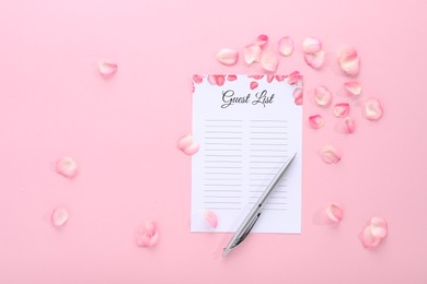 Guest list, pen and petals on pink background, flat lay. Space for text