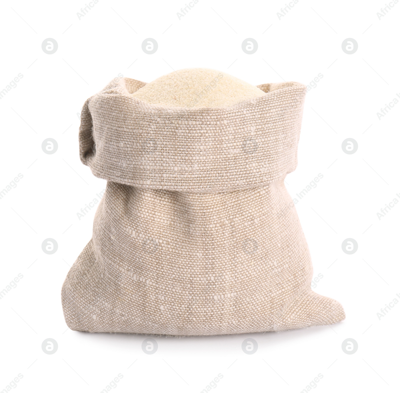 Photo of Uncooked organic semolina in bag on white background