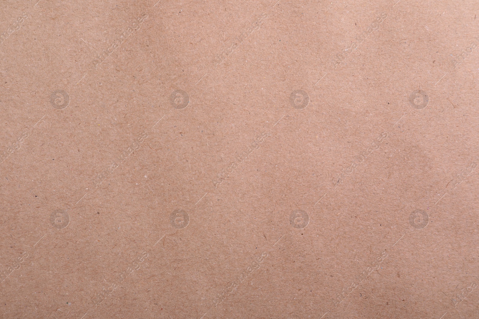 Photo of Texture of kraft paper bag as background, closeup