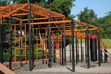 Photo of Empty outdoor gym with exercise equipment in park