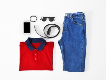Photo of Set of trendy male clothes and accessories on light background, flat lay