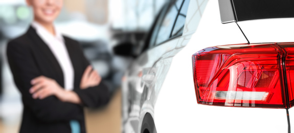 Image of Customer choosing and buying car in auto dealership, focus on new auto. Banner design 