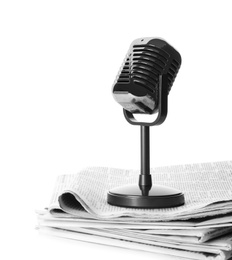 Photo of Newspapers and vintage microphone isolated on white. Journalist's work