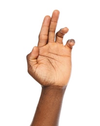 African-American man showing hand gesture on white background, closeup