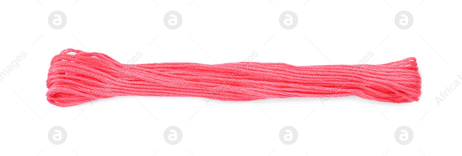 Photo of Bright pink embroidery thread on white background