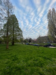 Photo of Canal with moored boats outdoors on spring day