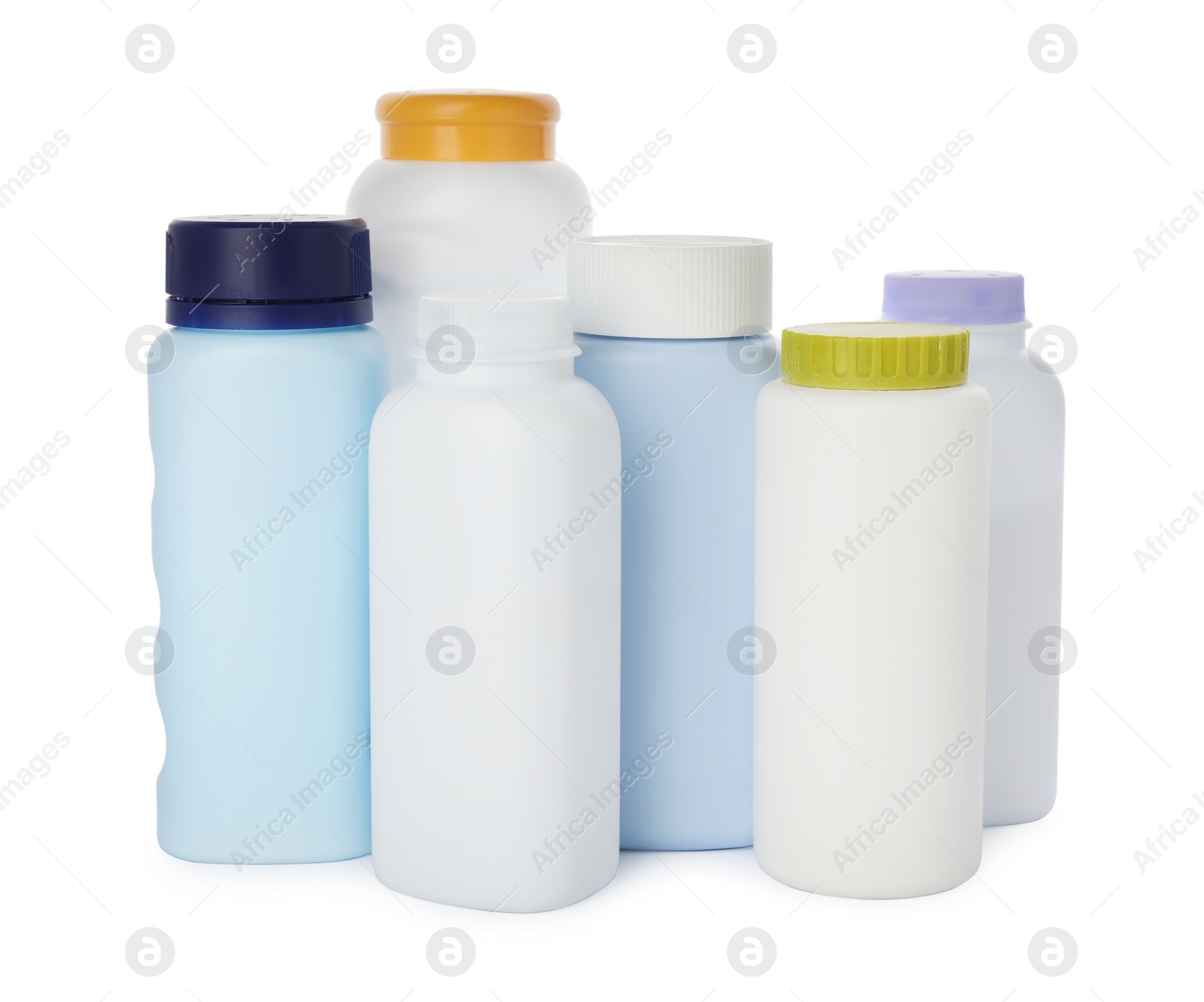 Photo of Bottles of dusting powder on white background, space for design. Baby cosmetic product