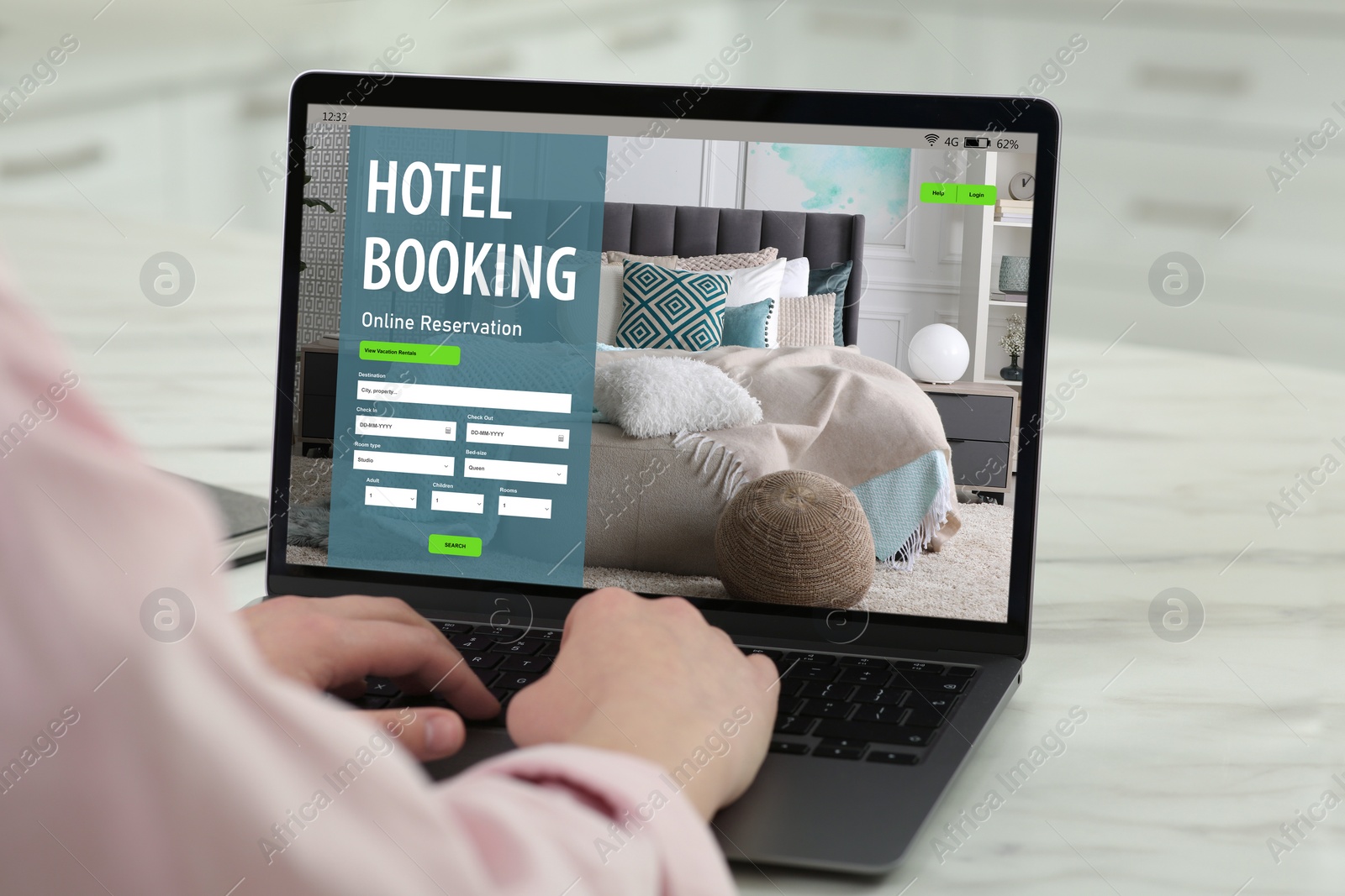 Image of Woman using laptop to book hotel at home, closeup