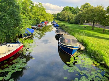 Beautiful view of moored boats in canal on sunny day