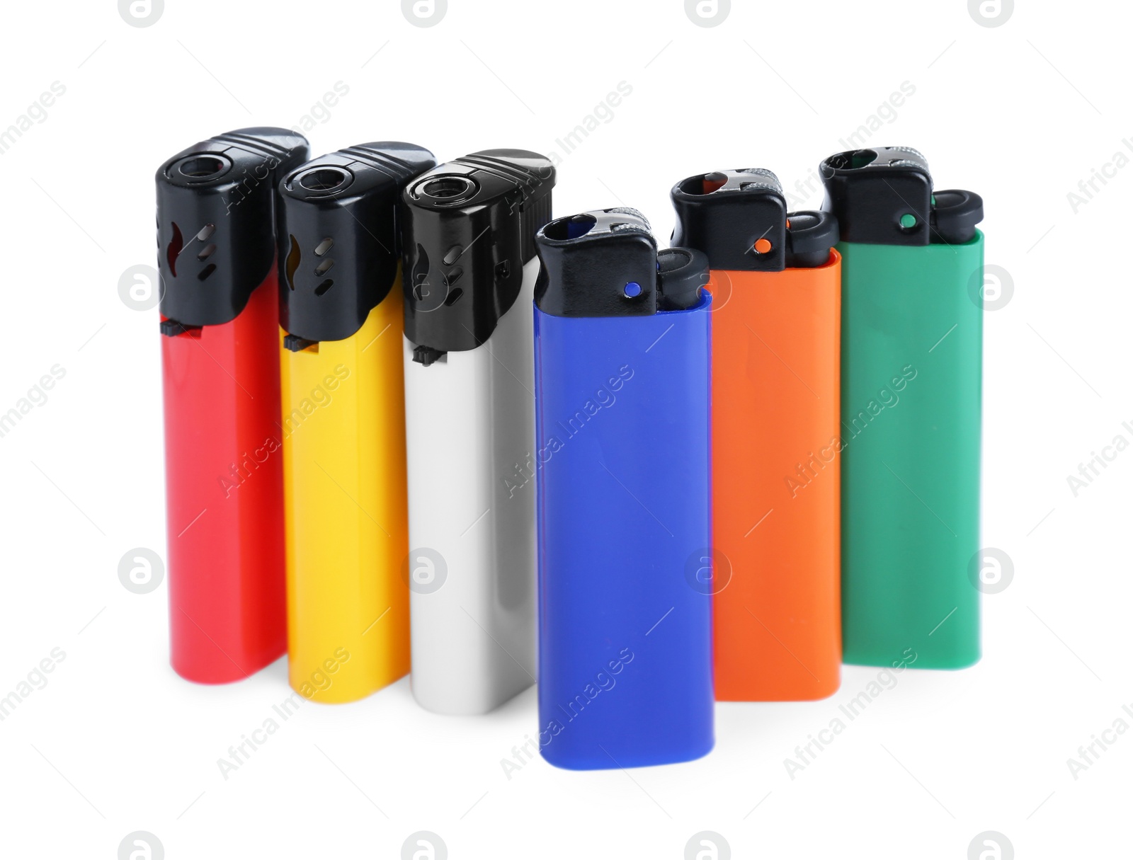 Photo of Stylish small pocket lighters on white background