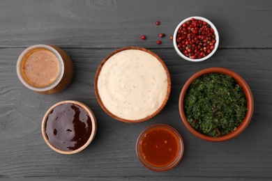 Photo of Different fresh marinades on grey wooden table, flat lay