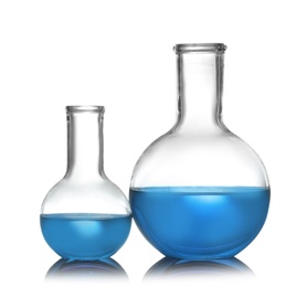 Photo of Florence flasks with liquid samples on white background. Chemistry glassware