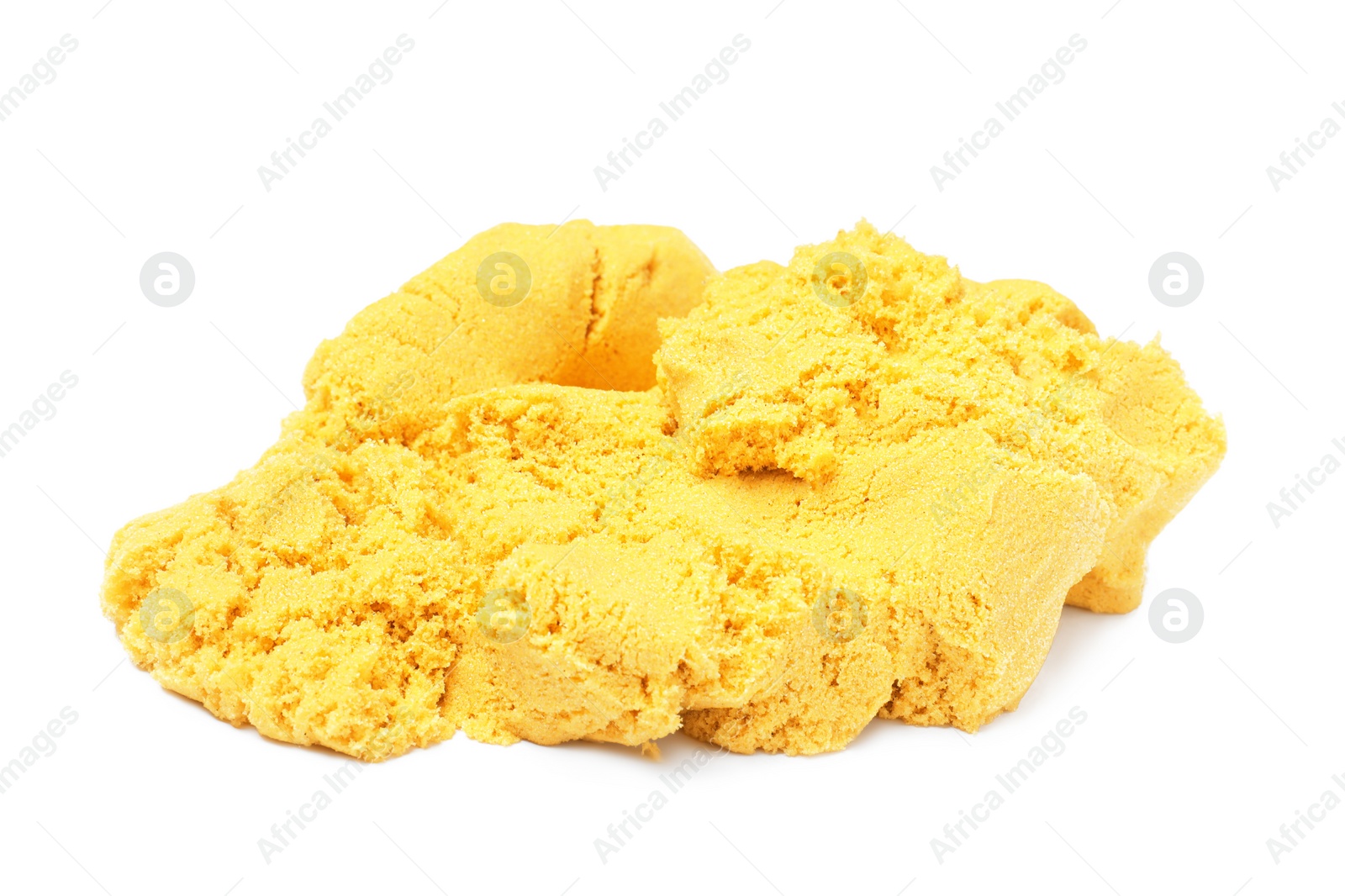 Photo of Pile of yellow kinetic sand on white background