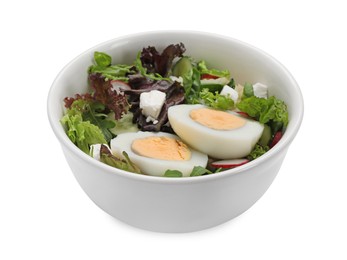 Photo of Delicious salad with boiled egg, feta cheese and vegetables in bowl isolated on white