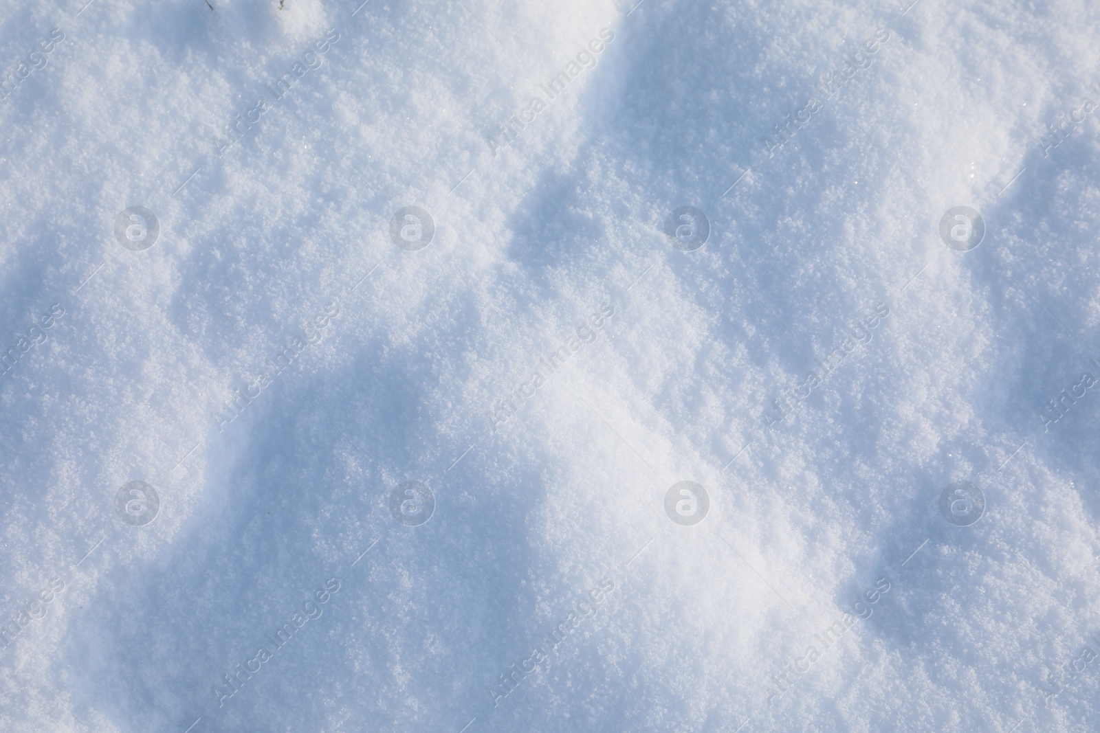 Photo of Beautiful white snow as background, closeup view