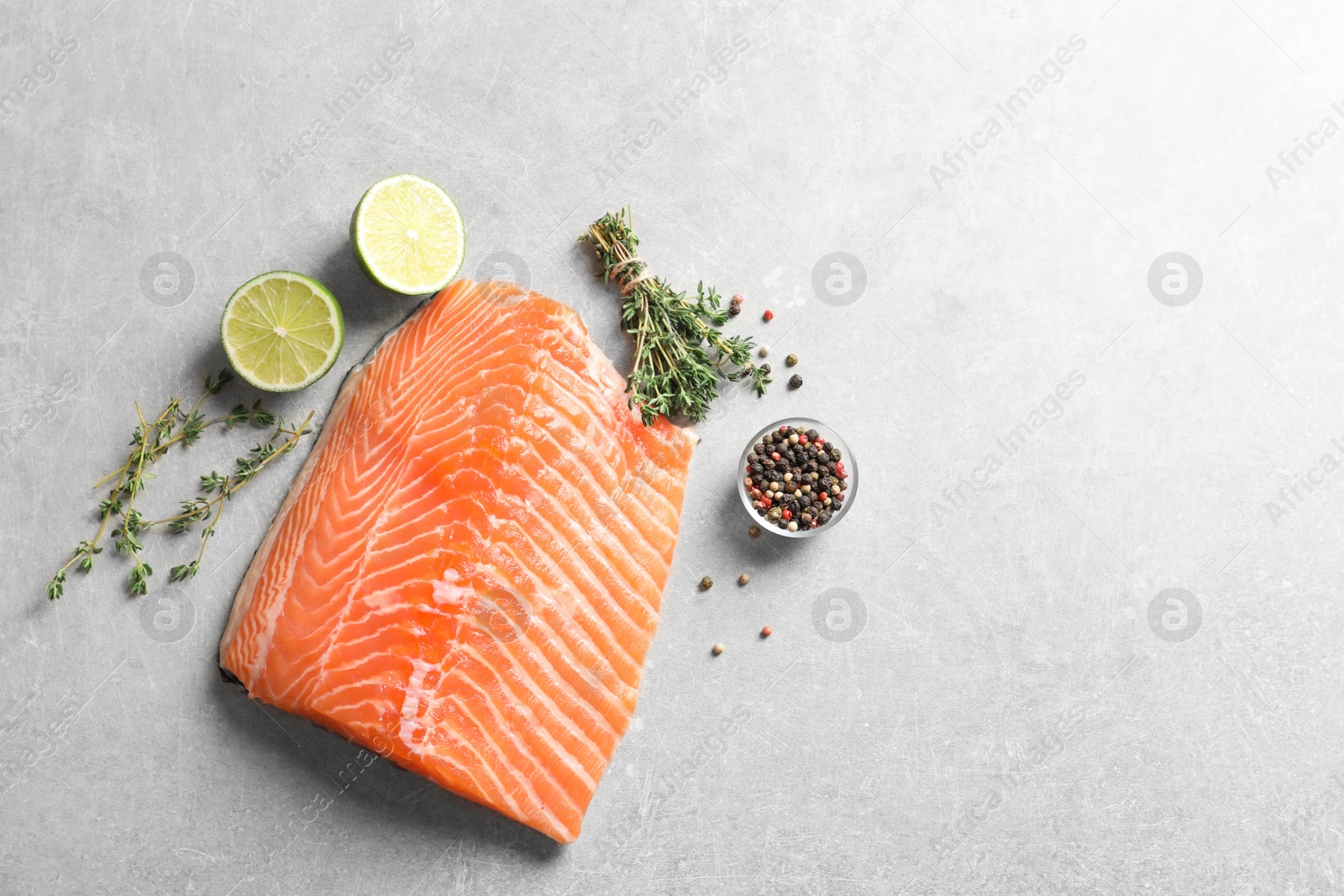 Photo of Raw salmon fillet and ingredients for marinade on table, top view