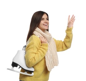 Photo of Happy woman with ice skates on white background