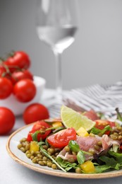 Photo of Plate of salad with mung beans on white table, closeup