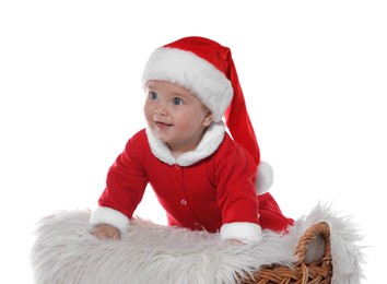 Cute baby in wicker basket on white background. Christmas celebration