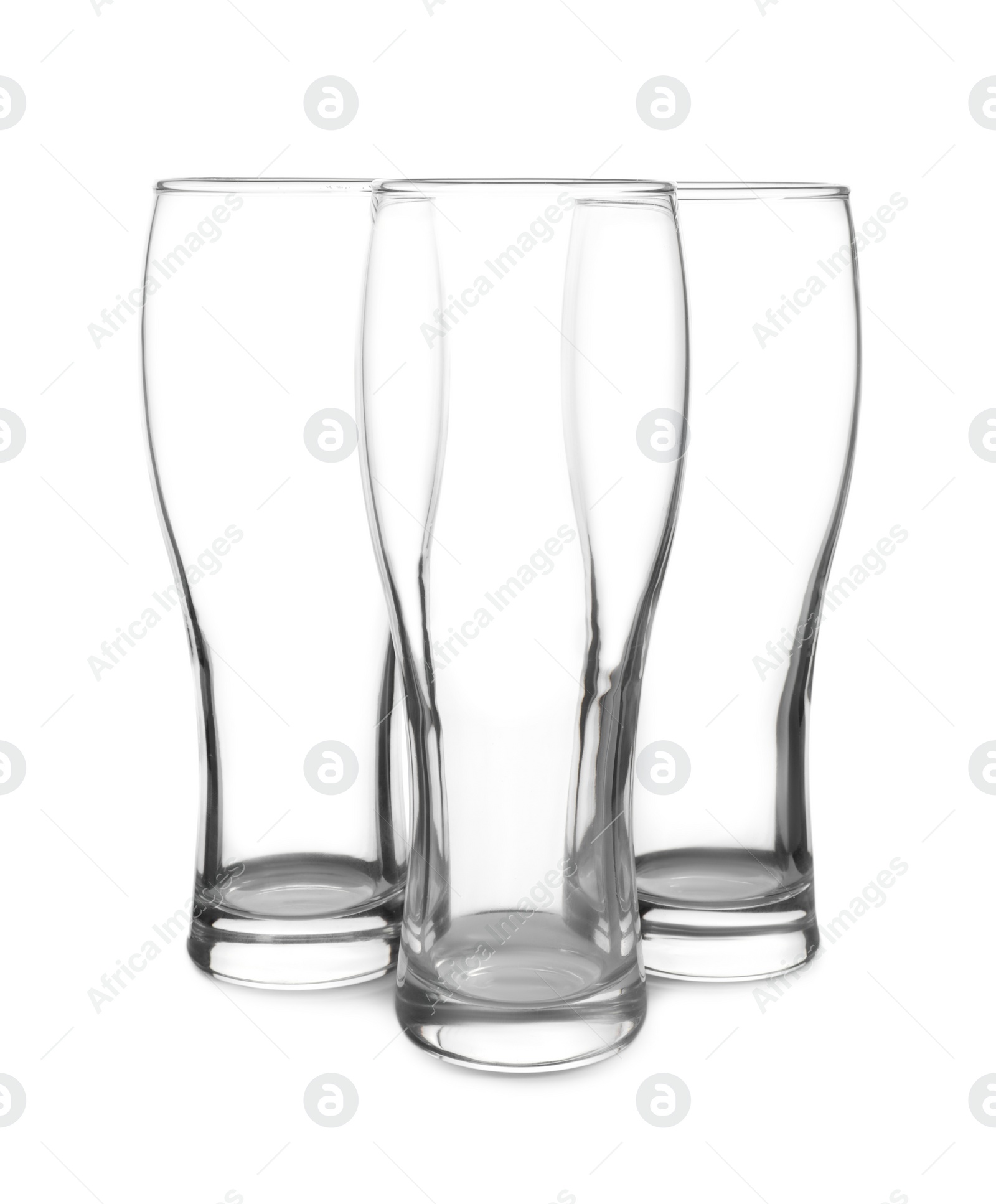 Photo of Elegant clean empty beer glasses isolated on white