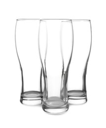 Photo of Elegant clean empty beer glasses isolated on white