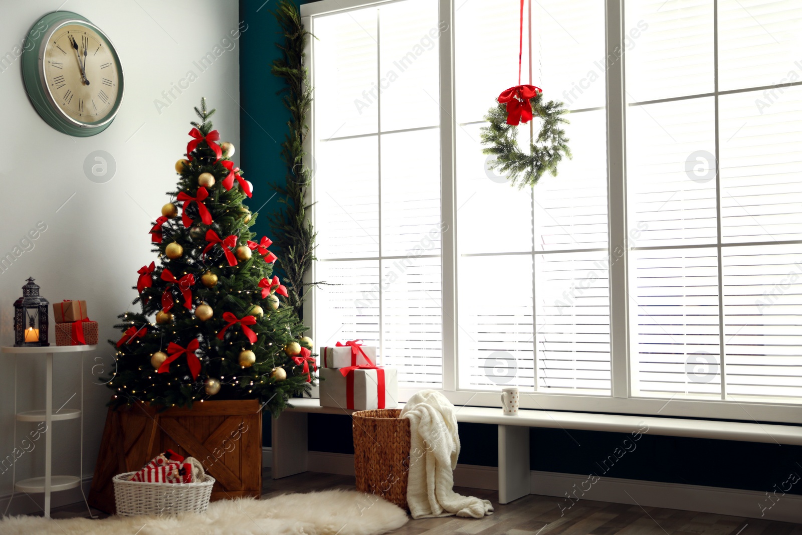 Photo of Stylish room interior with decorated Christmas tree