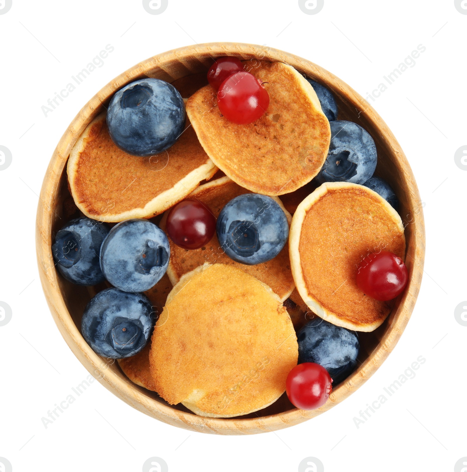 Photo of Delicious mini pancakes cereal with berries on white background, top view