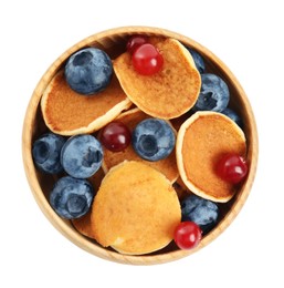 Photo of Delicious mini pancakes cereal with berries on white background, top view